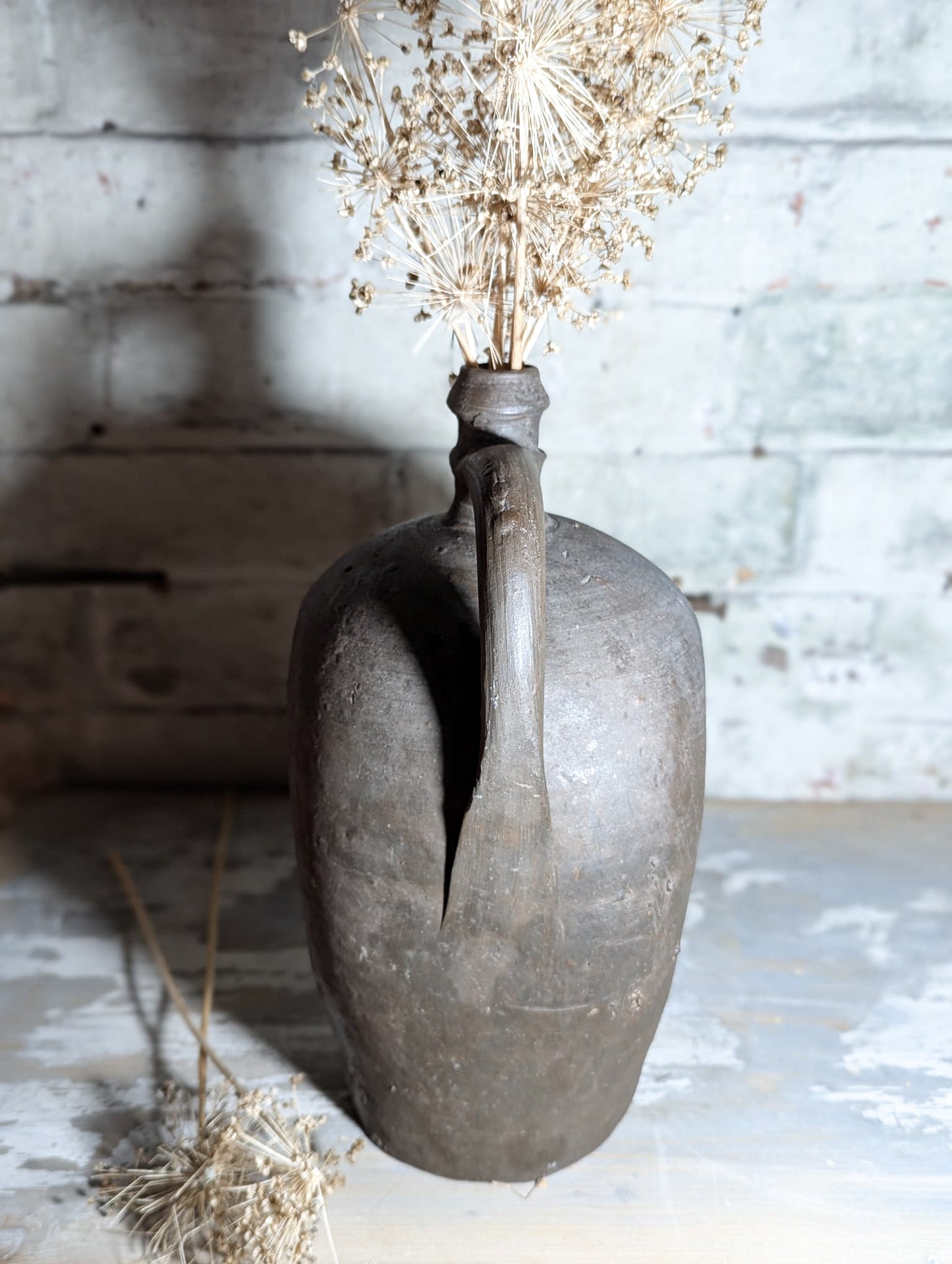 A stunning large Primitive French Antique Black Pottery oil bottle