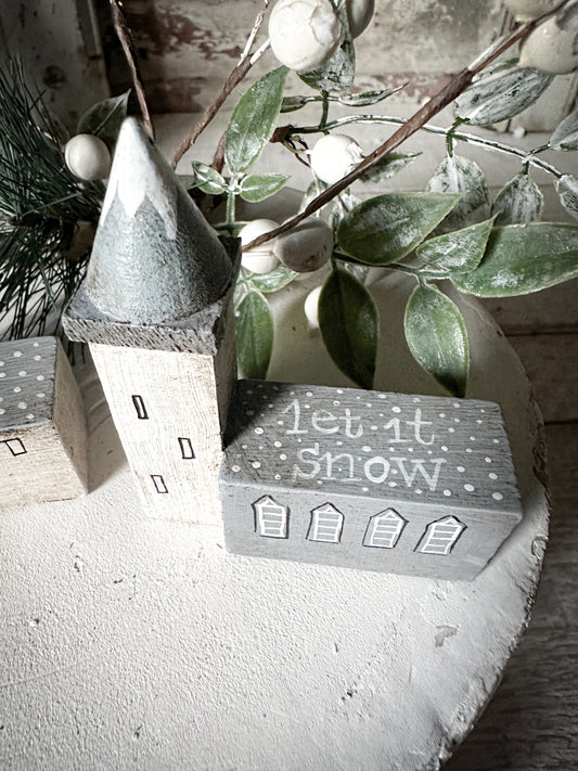 A pretty vintage German Erzgebirge Putz wooden village house painted with a Christmas quote