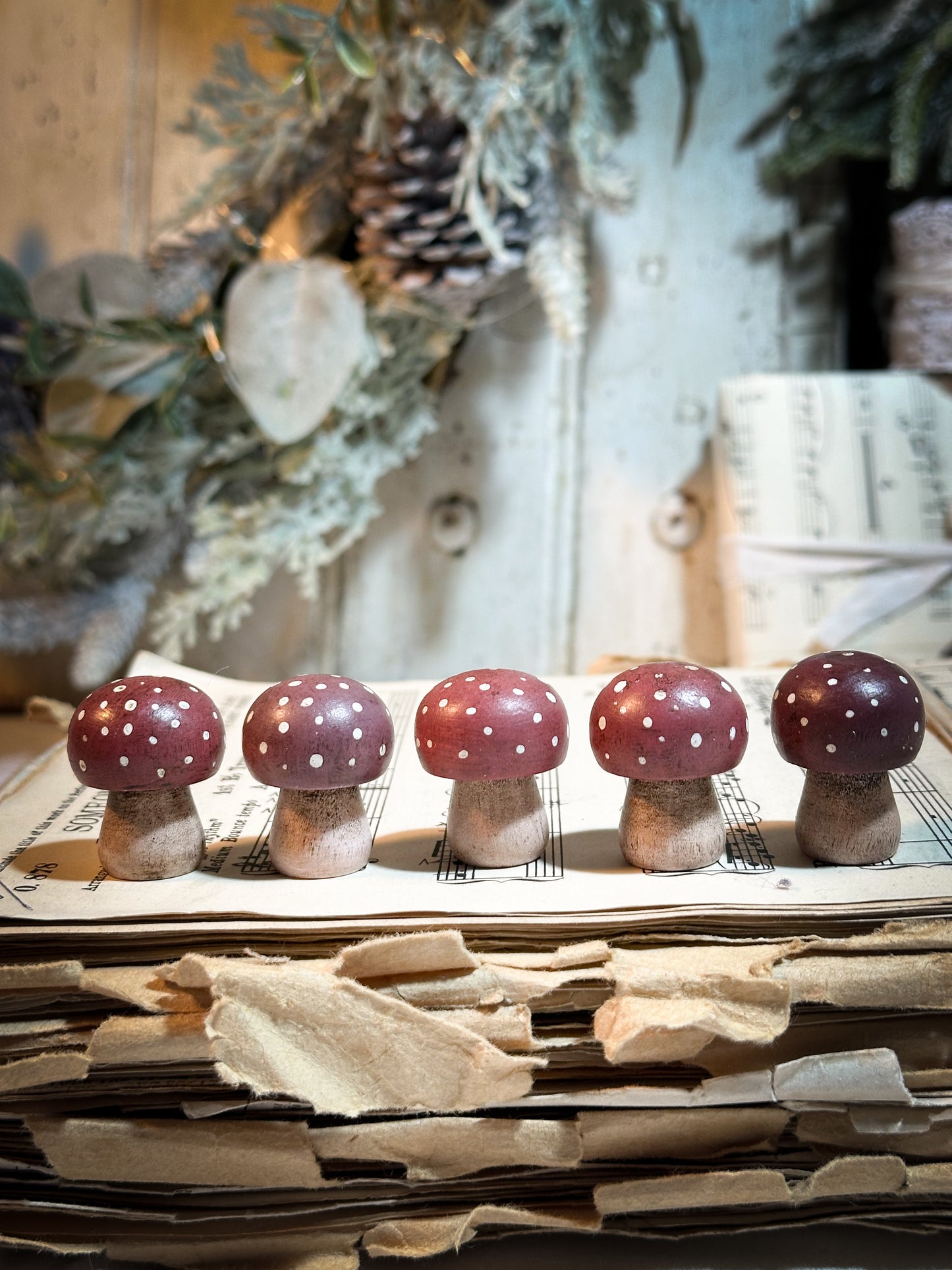 A wooden hand painted Christmas village toadstool