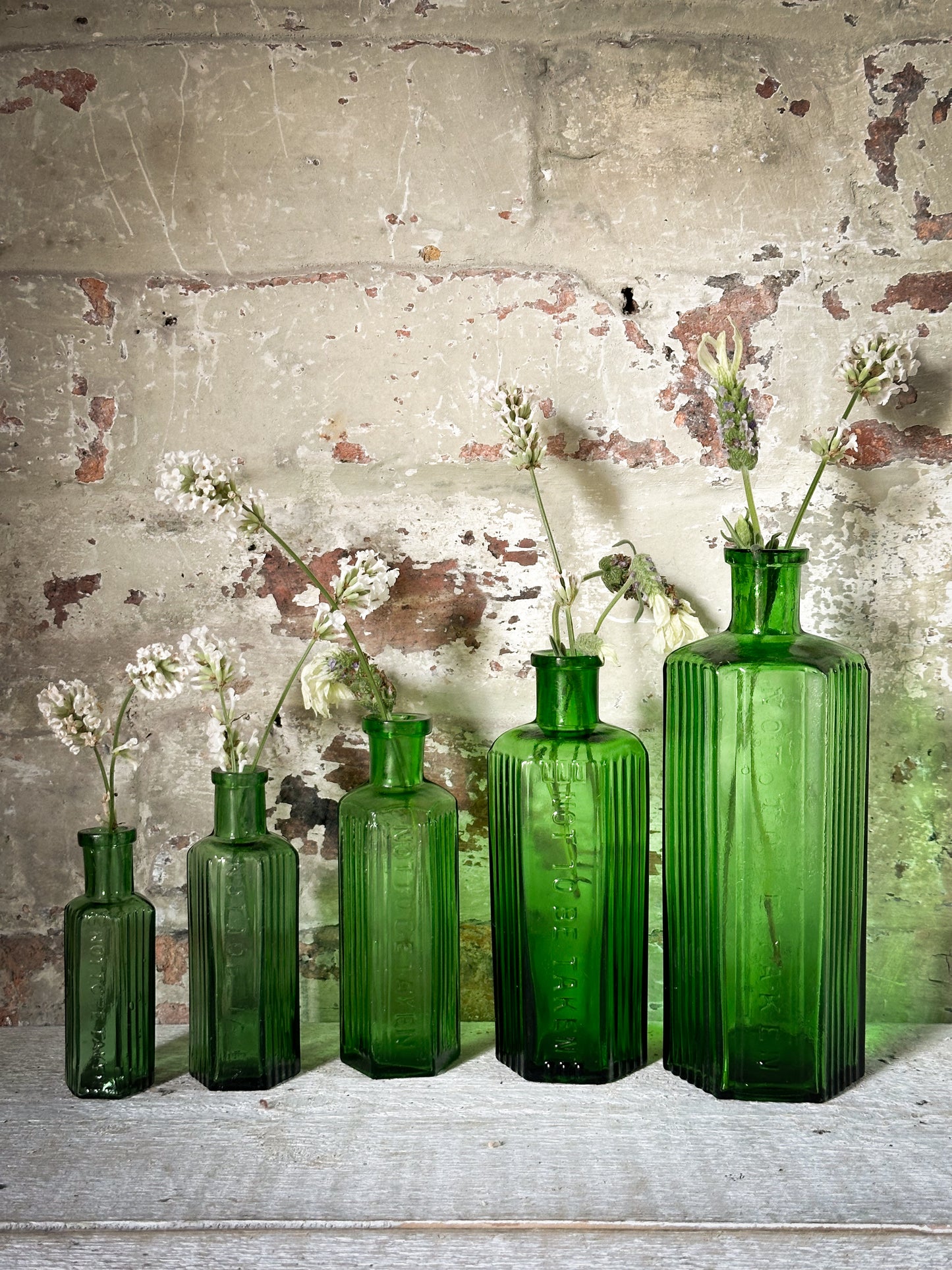 A set of Five lovely antique green poison bottles