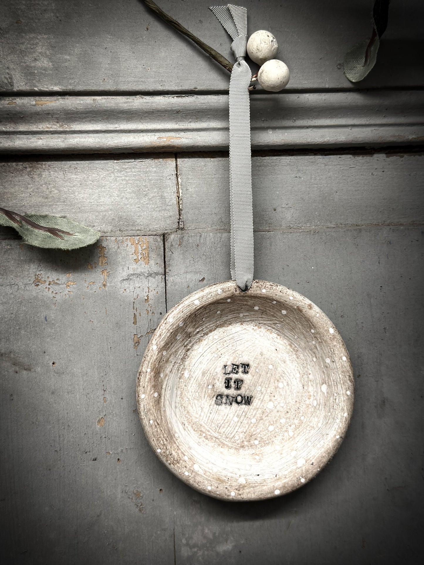 A Reworked French Patisserie Tin Christmas Decoration Stamped and Painted “Let It Snow”