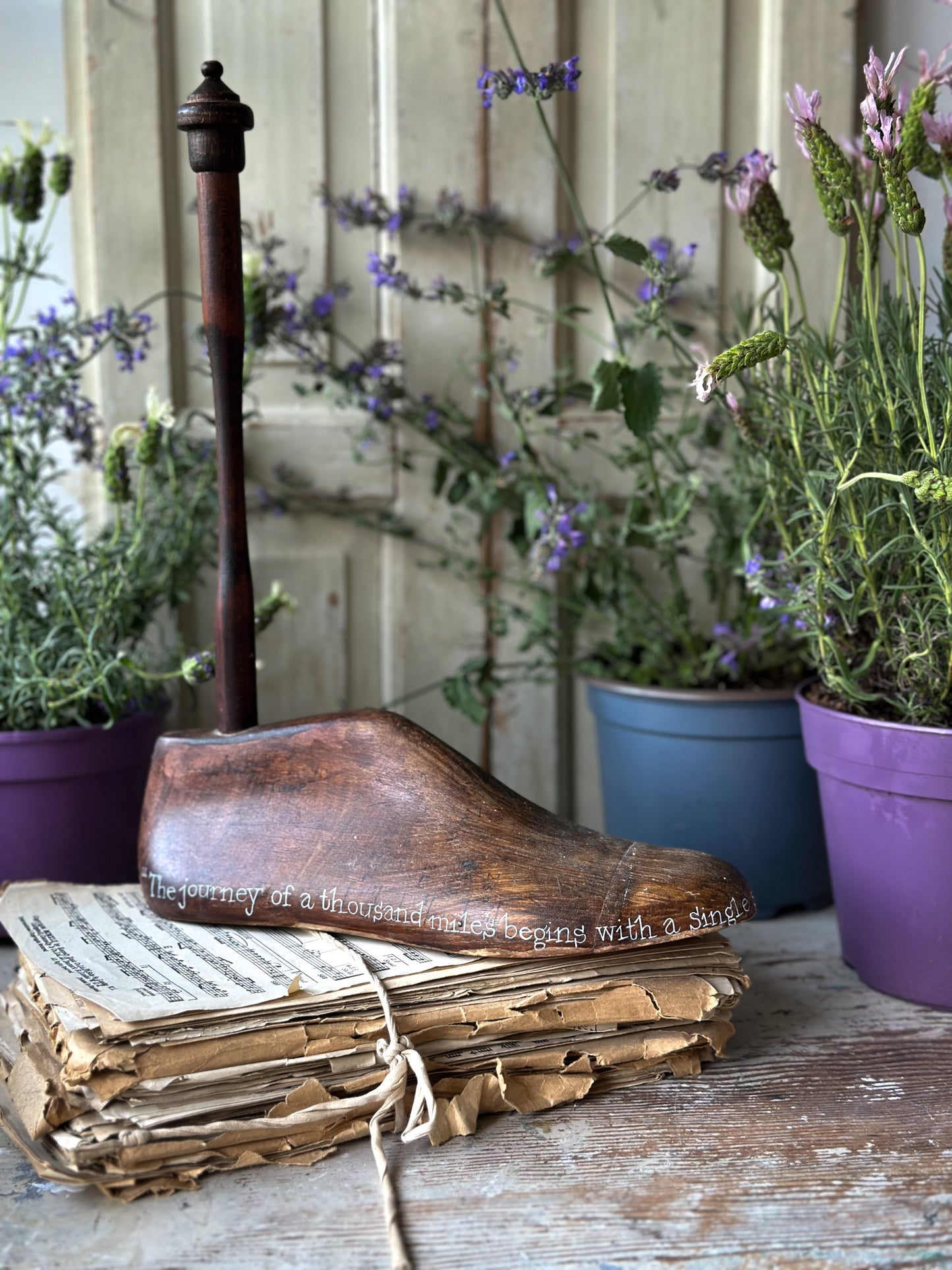 An antique wooden painted adult’s shoe last.