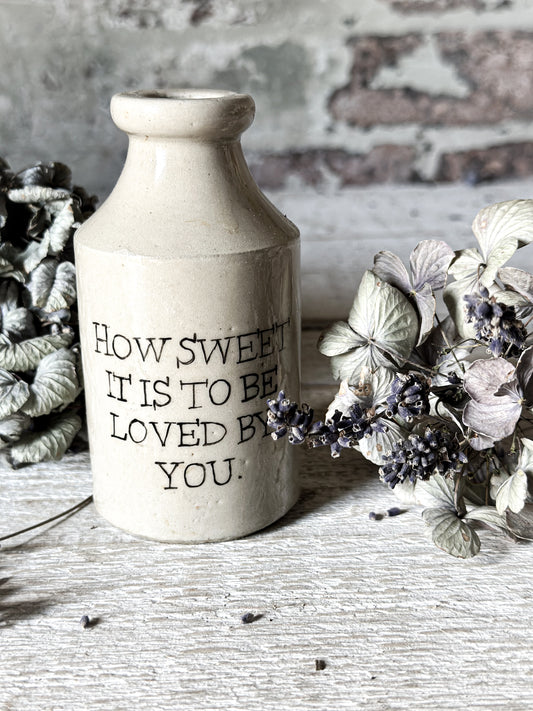 A Victorian unearthed short stoneware pottery bottle with a hand painted quote