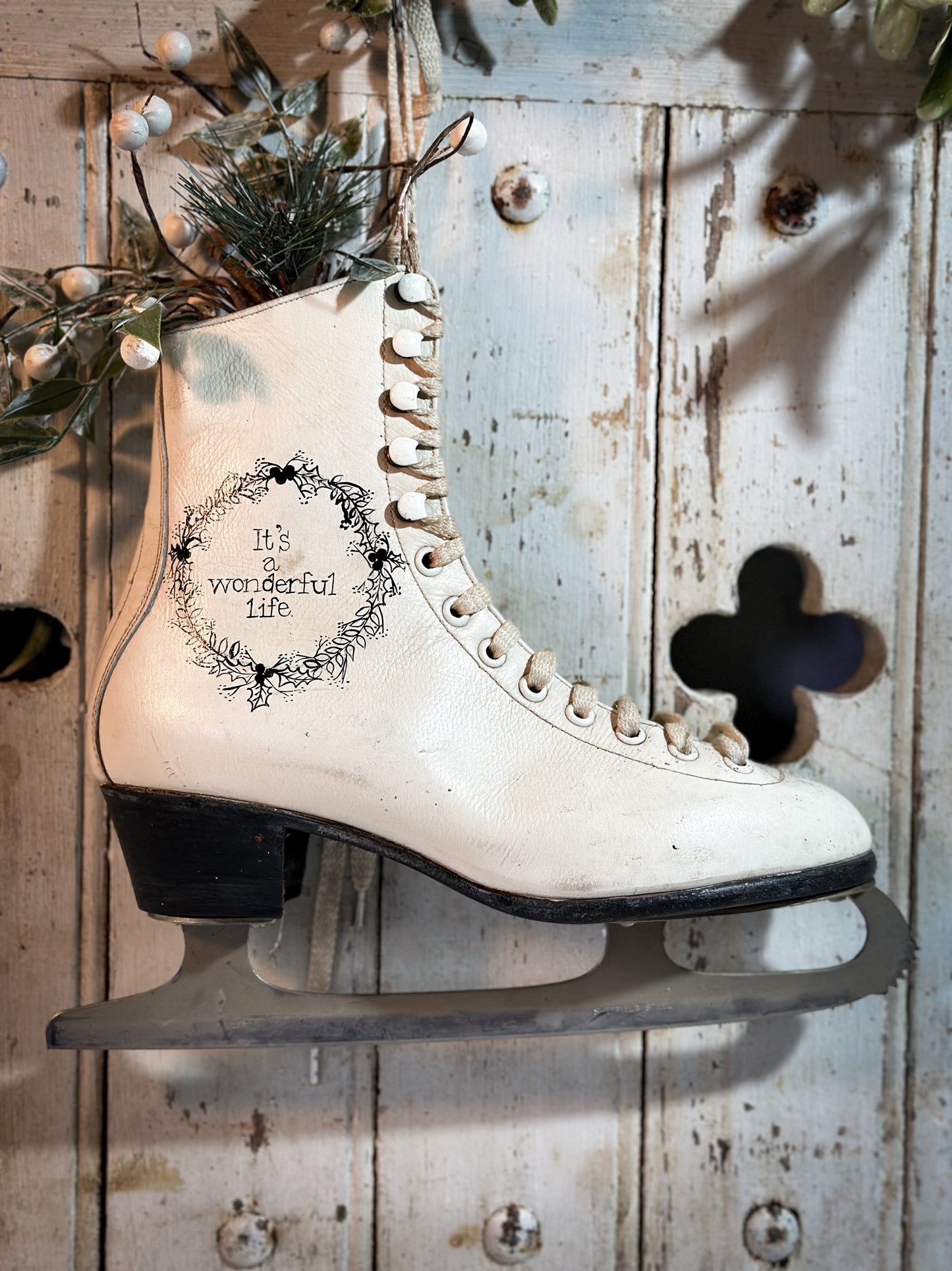 A beautiful vintage Christmas ice skate hand painted using traditional sign writer’s techniques and materials