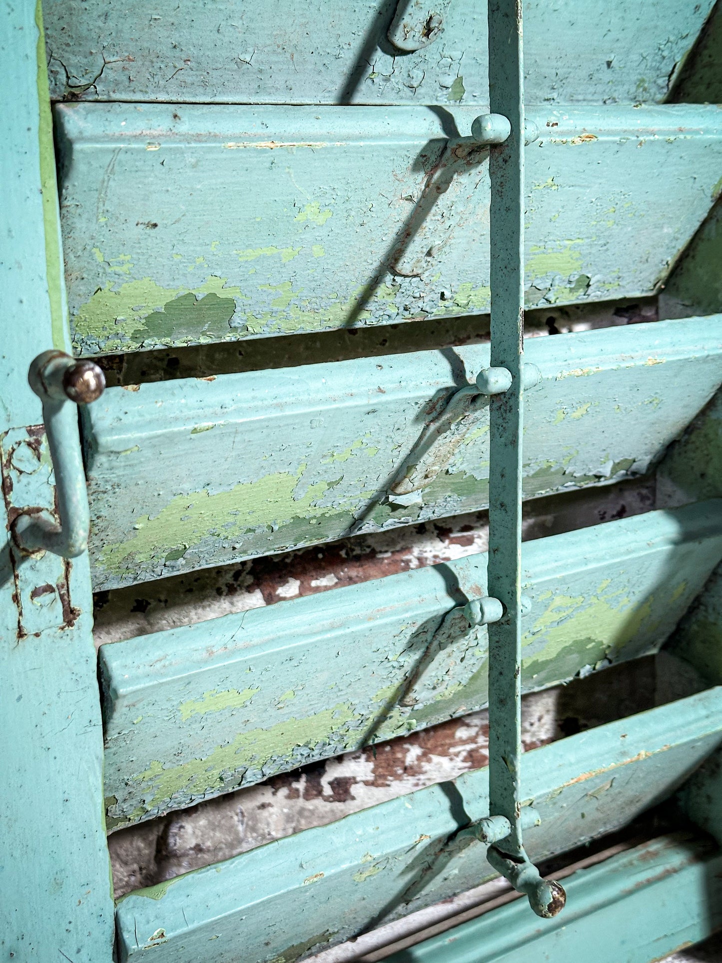 A Pair of French Green Chippy Painted Shutters