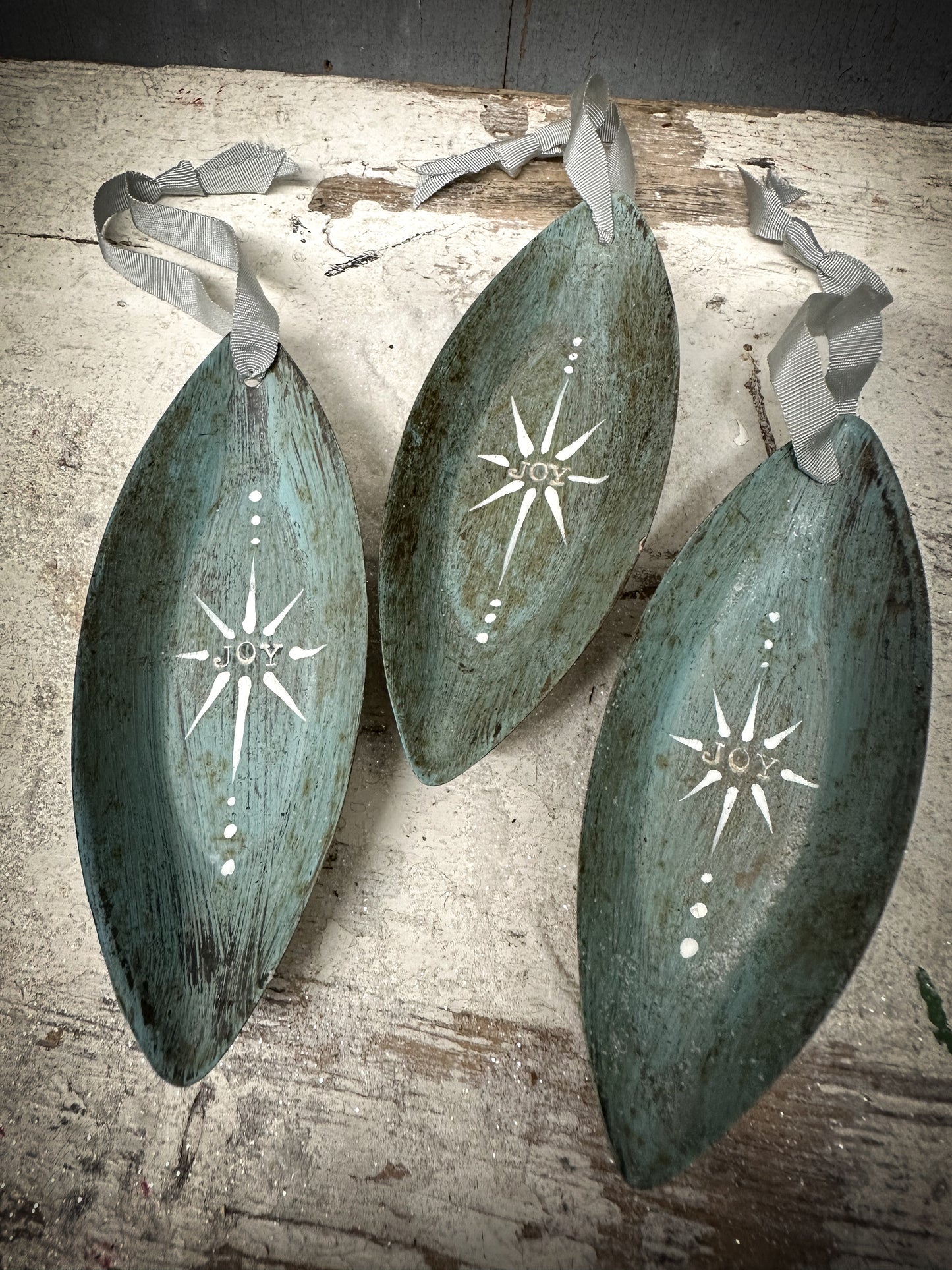 A Reworked French Patisserie Tin Christmas Decoration Stamped and Painted “Joy”