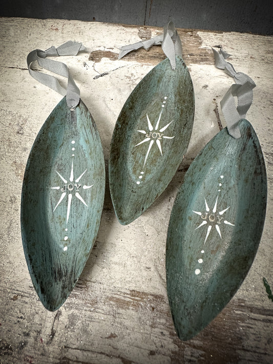 A Reworked French Patisserie Tin Christmas Decoration Stamped and Painted “Joy”