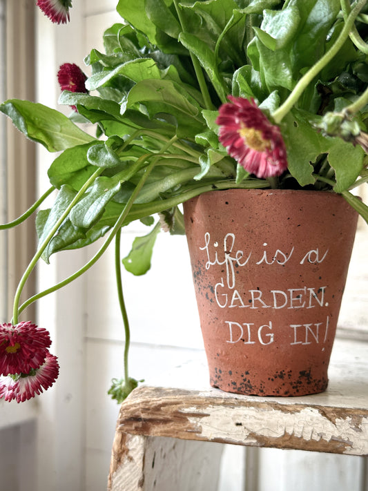 A Victorian terracotta pot with a quote