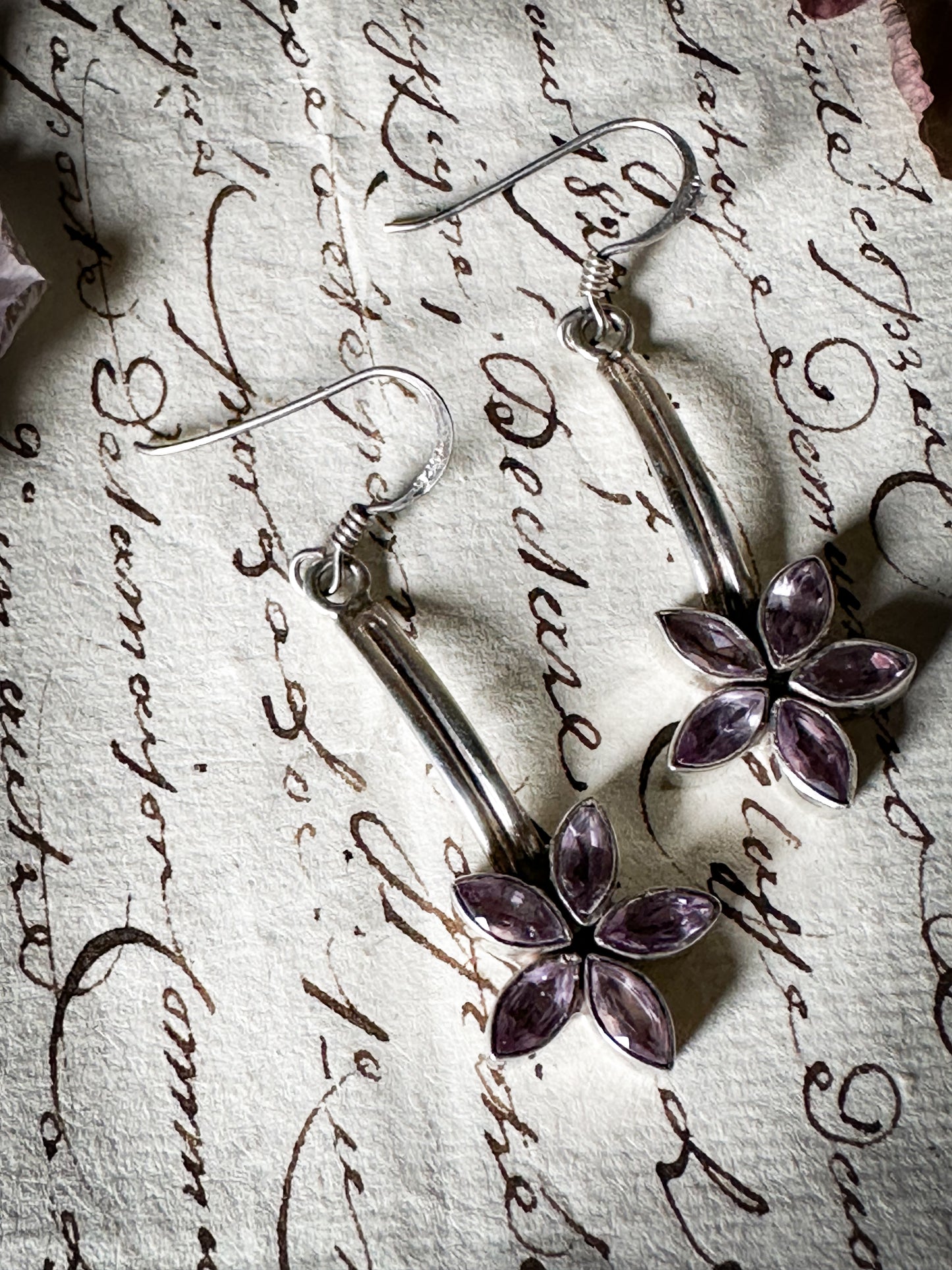 A pair of vintage silver amethyst flower drop earrings