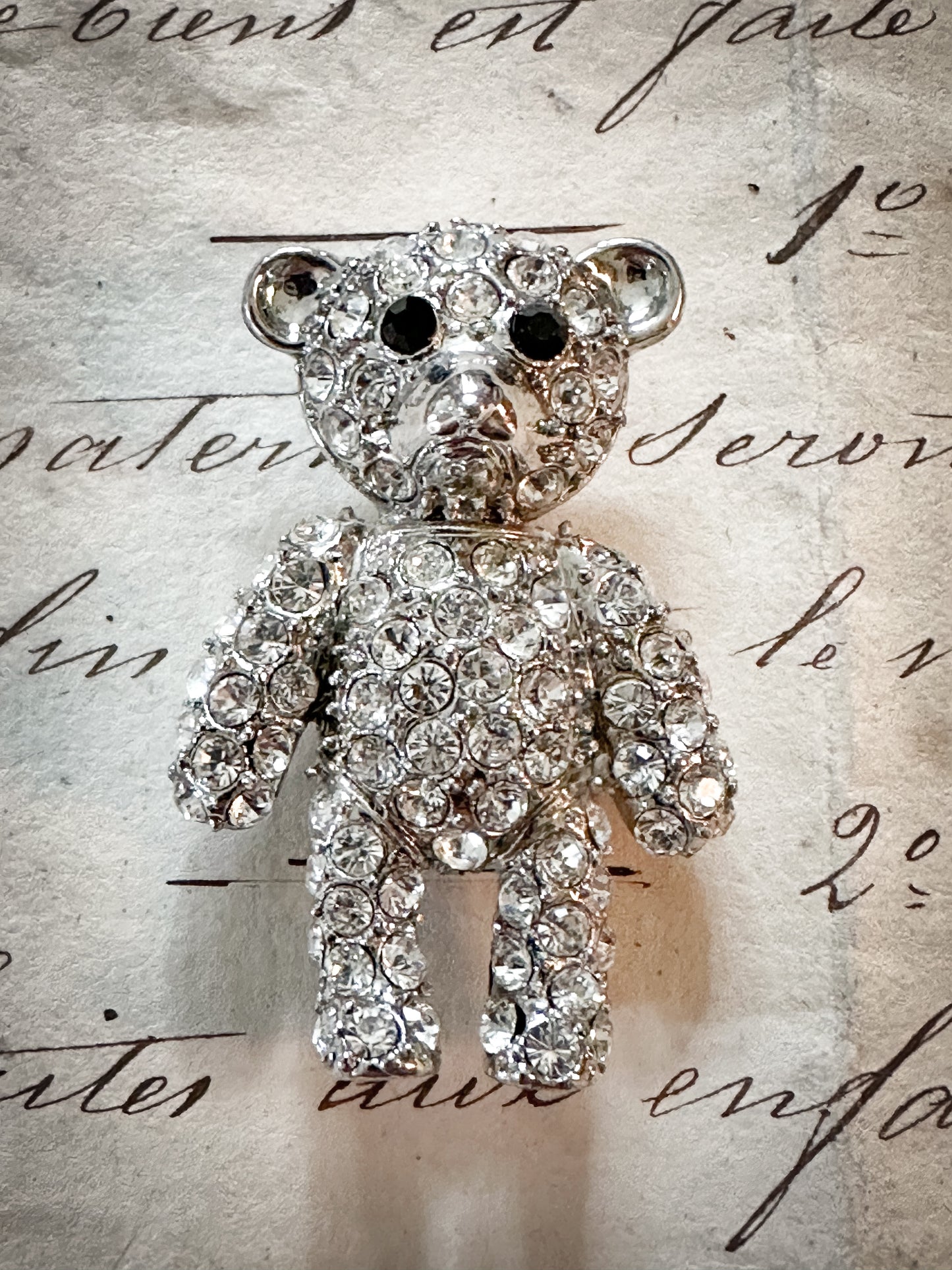 A sweet vintage diamanté teddy bear brooch