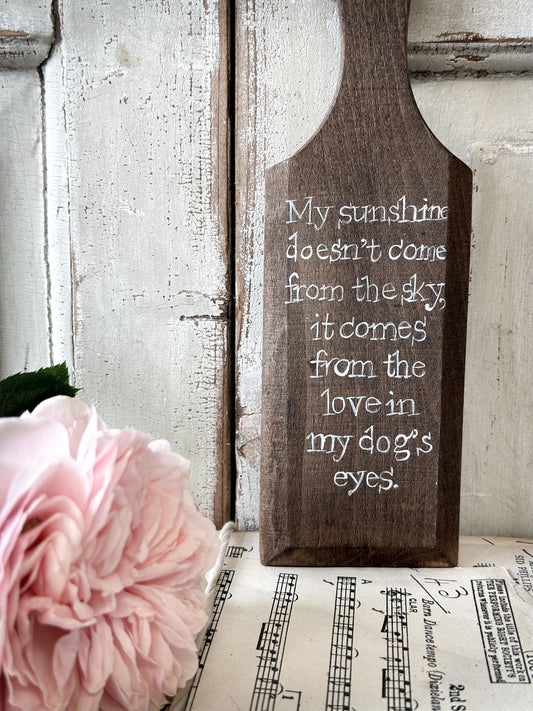 A hand painted vintage wooden butter pat “My Sunshine…comes from my Dog’s eyes”