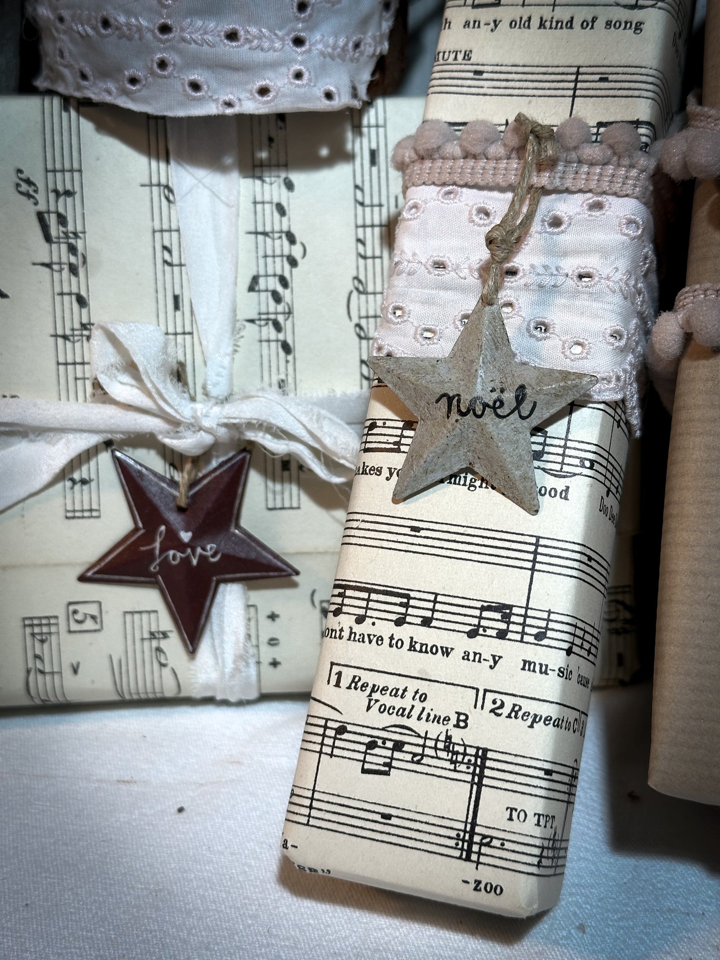 A mini tin barn star red decoration hand painted with “Love”