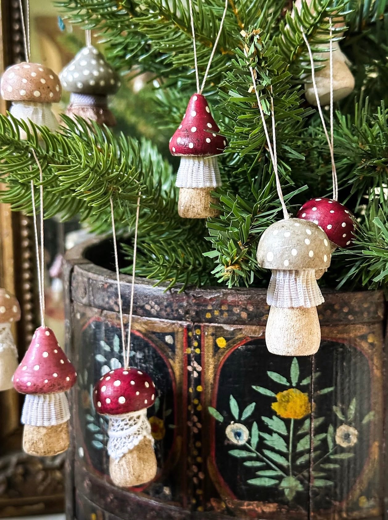 A wooden hand painted and trimmed Hanging Christmas tree toadstool