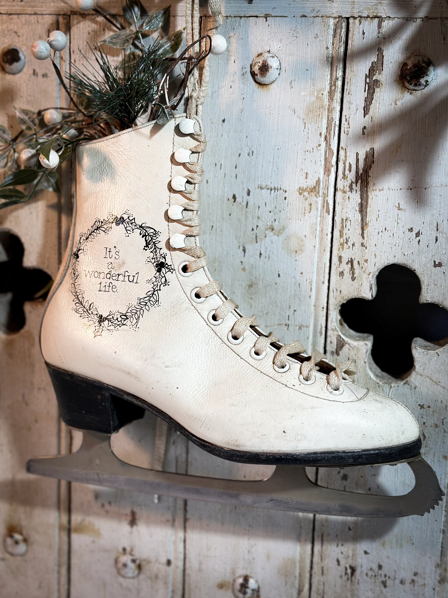 A beautiful vintage Christmas ice skate hand painted using traditional sign writer’s techniques and materials