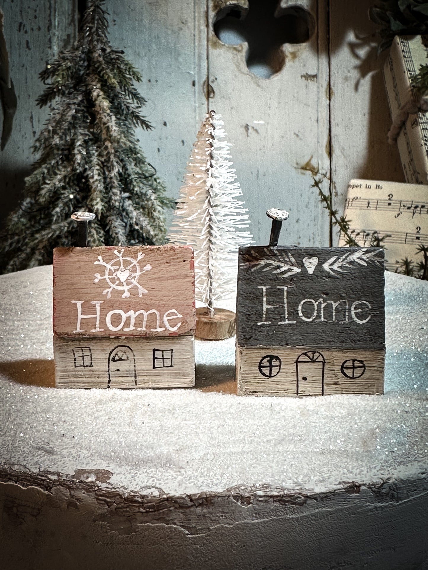 A pretty vintage German Erzgebirge Putz wooden village house painted with a Christmas quote