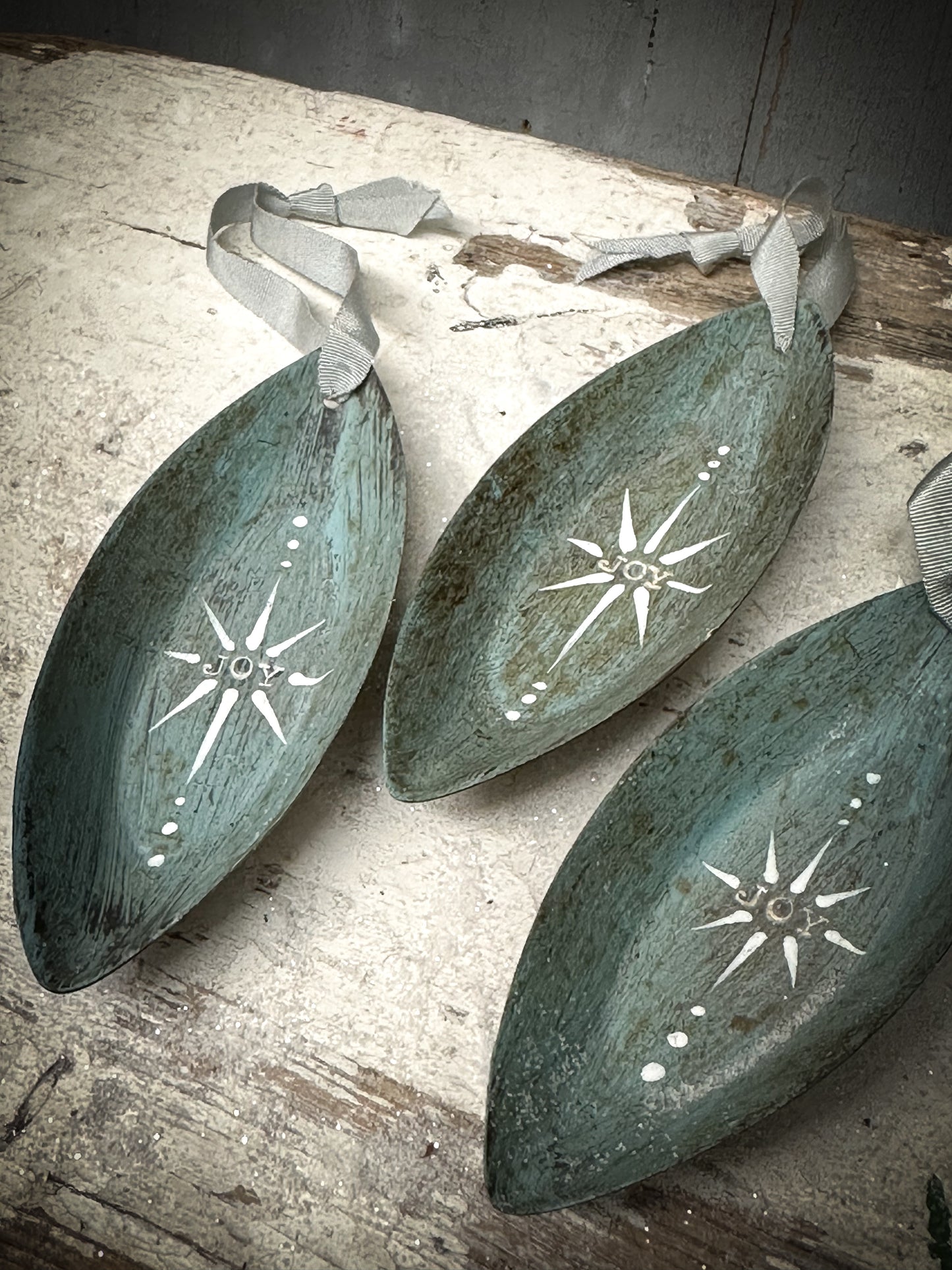 A Reworked French Patisserie Tin Christmas Decoration Stamped and Painted “Joy”