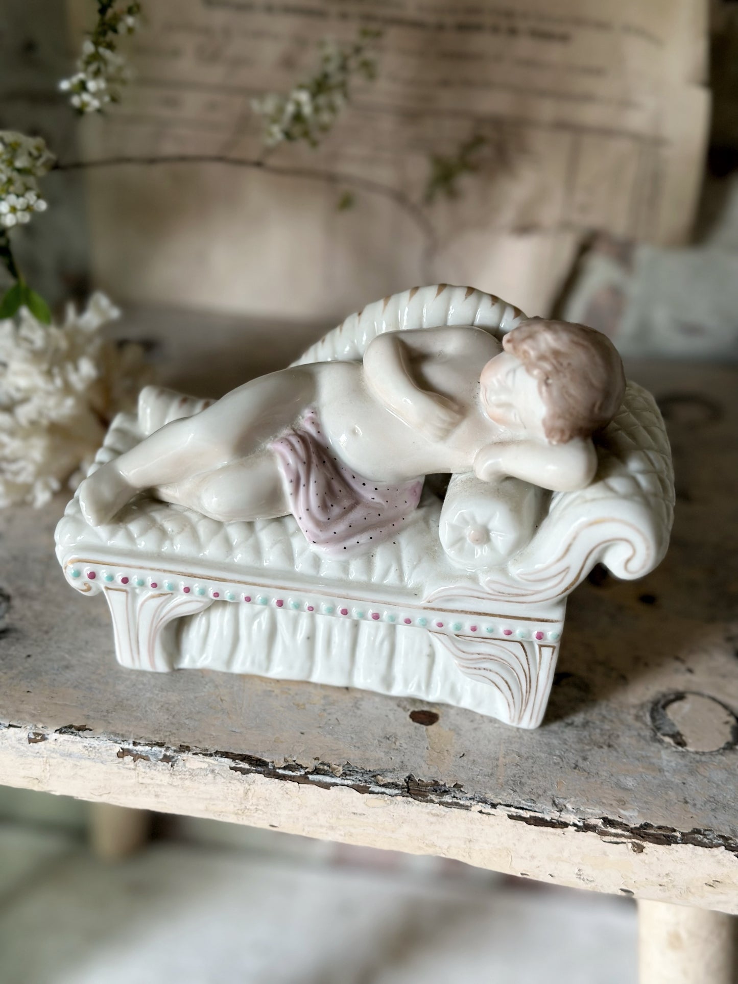 A beautiful antique Staffordshire pottery reclining lady figurine