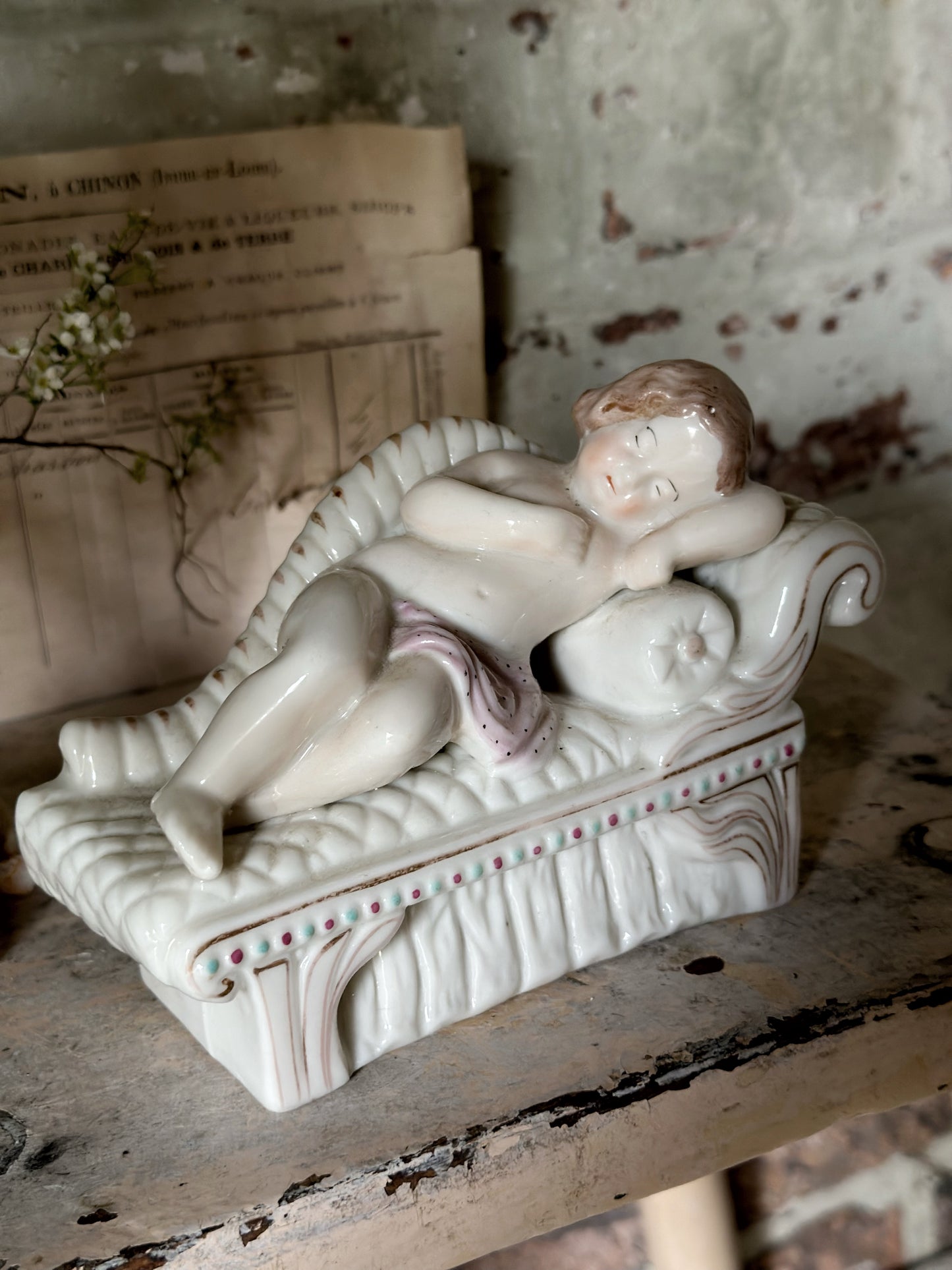 A beautiful antique Staffordshire pottery reclining lady figurine