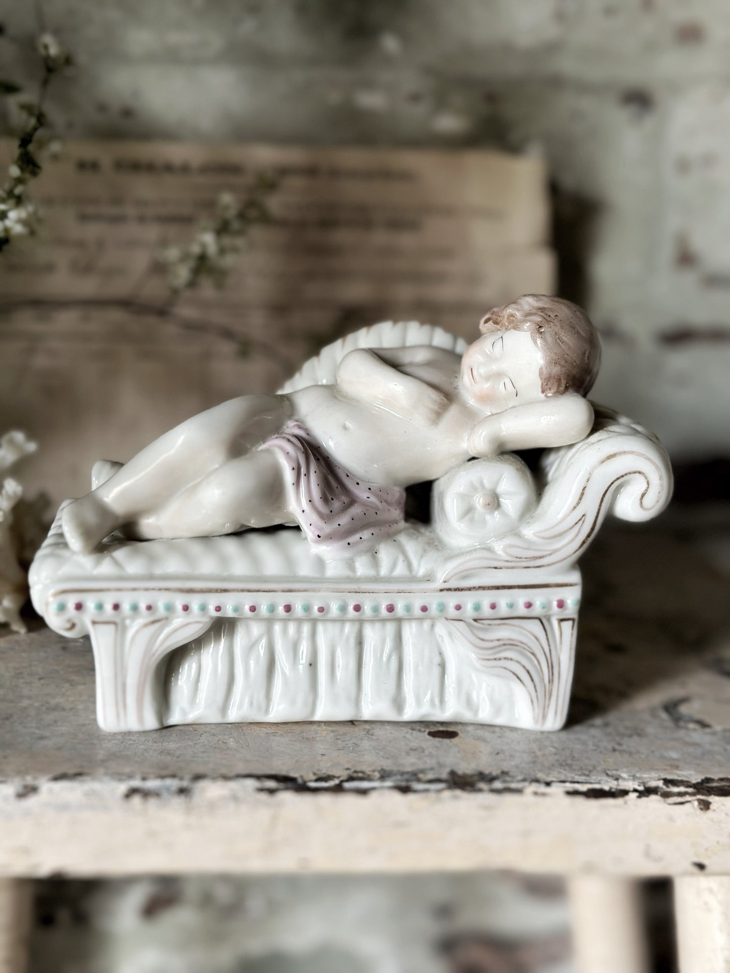 A beautiful antique Staffordshire pottery reclining lady figurine