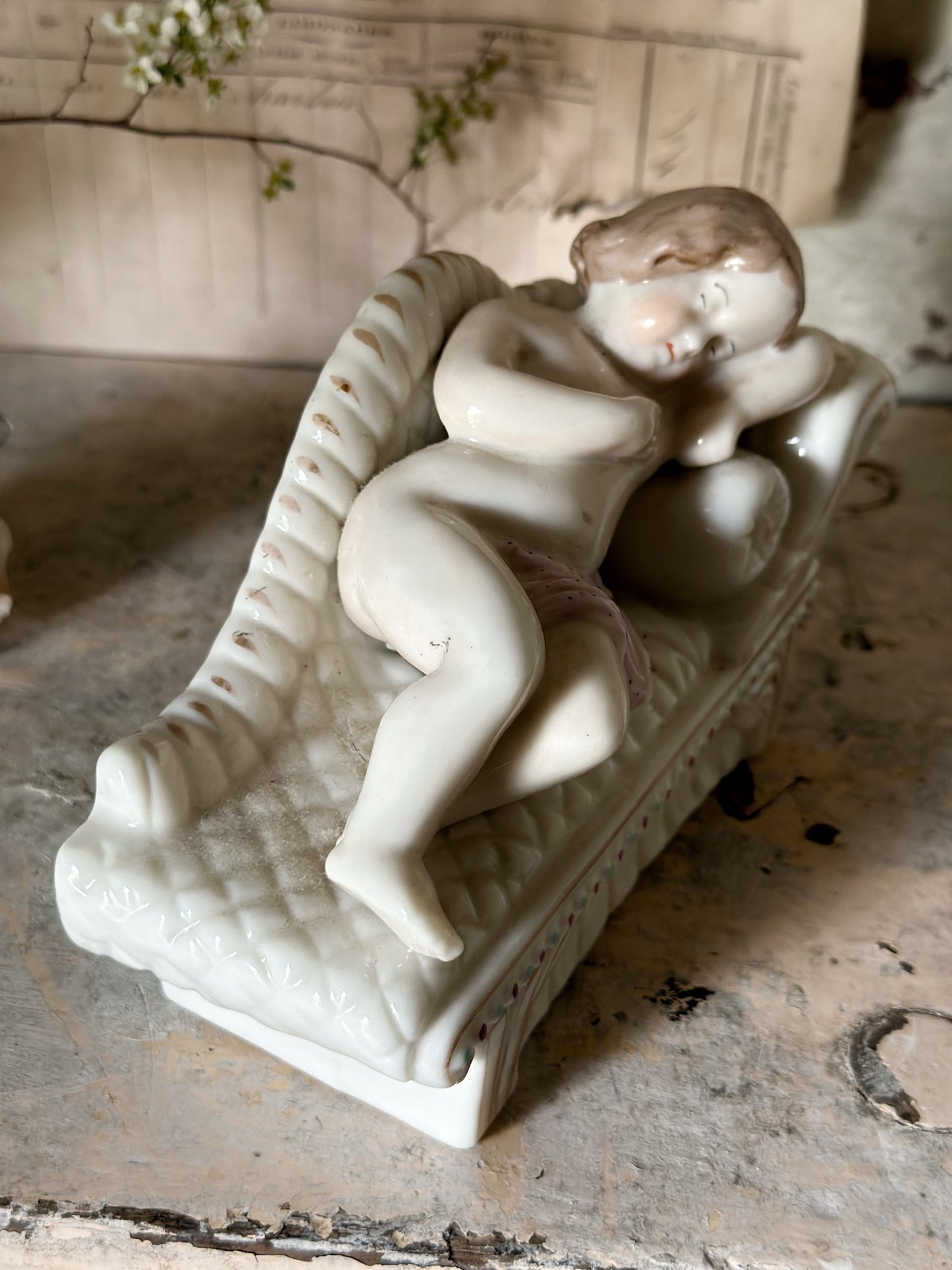 A beautiful antique Staffordshire pottery reclining lady figurine