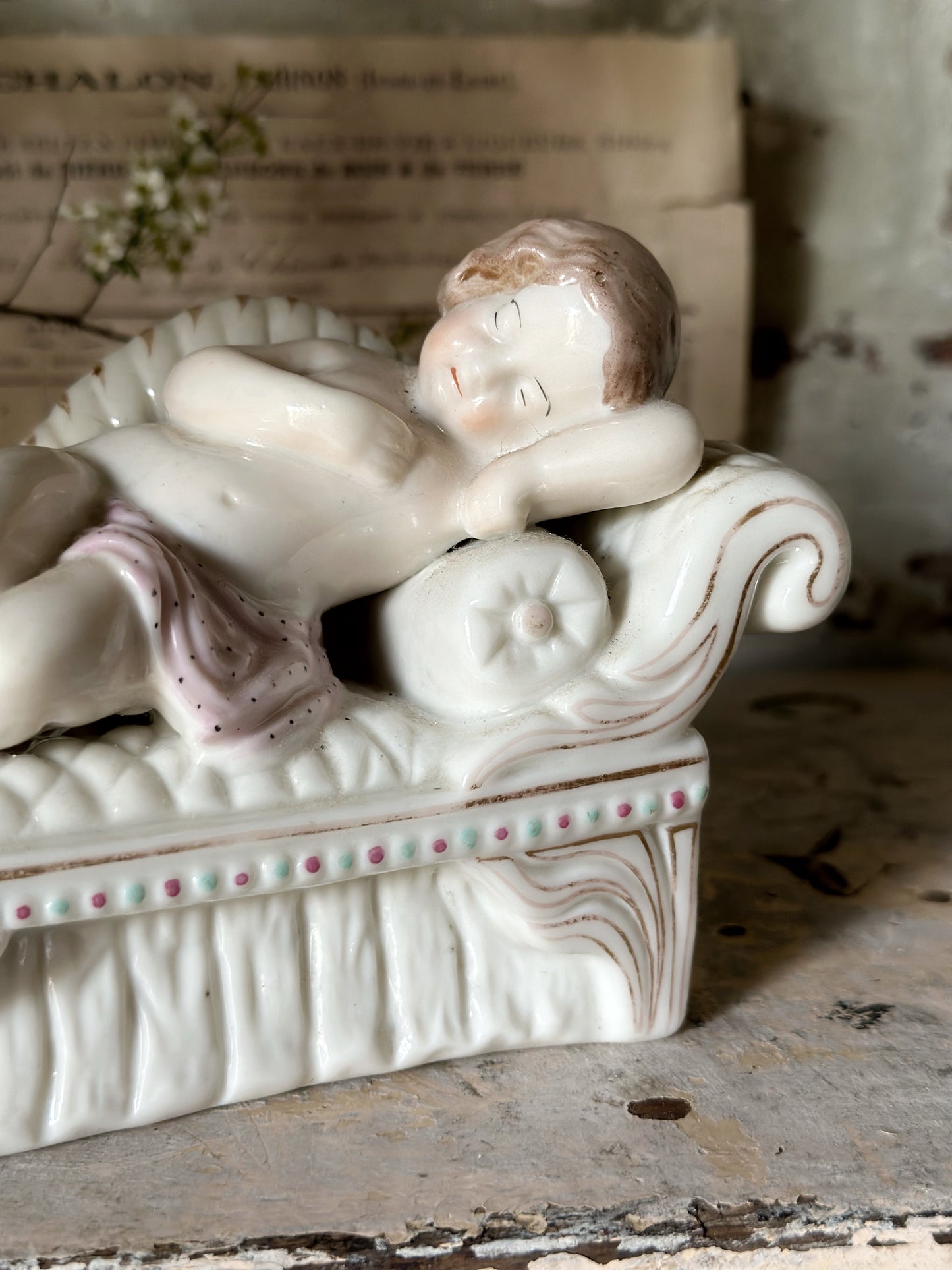 A beautiful antique Staffordshire pottery reclining lady figurine